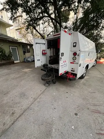 Magnet Plumbing service vehicle on-site for Grease Trap Cleaning in Guajome